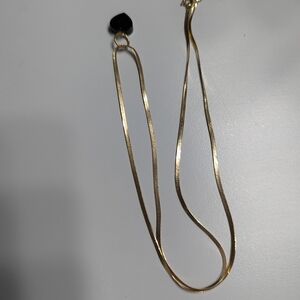 Elegant Gold Necklace with Black Pendant